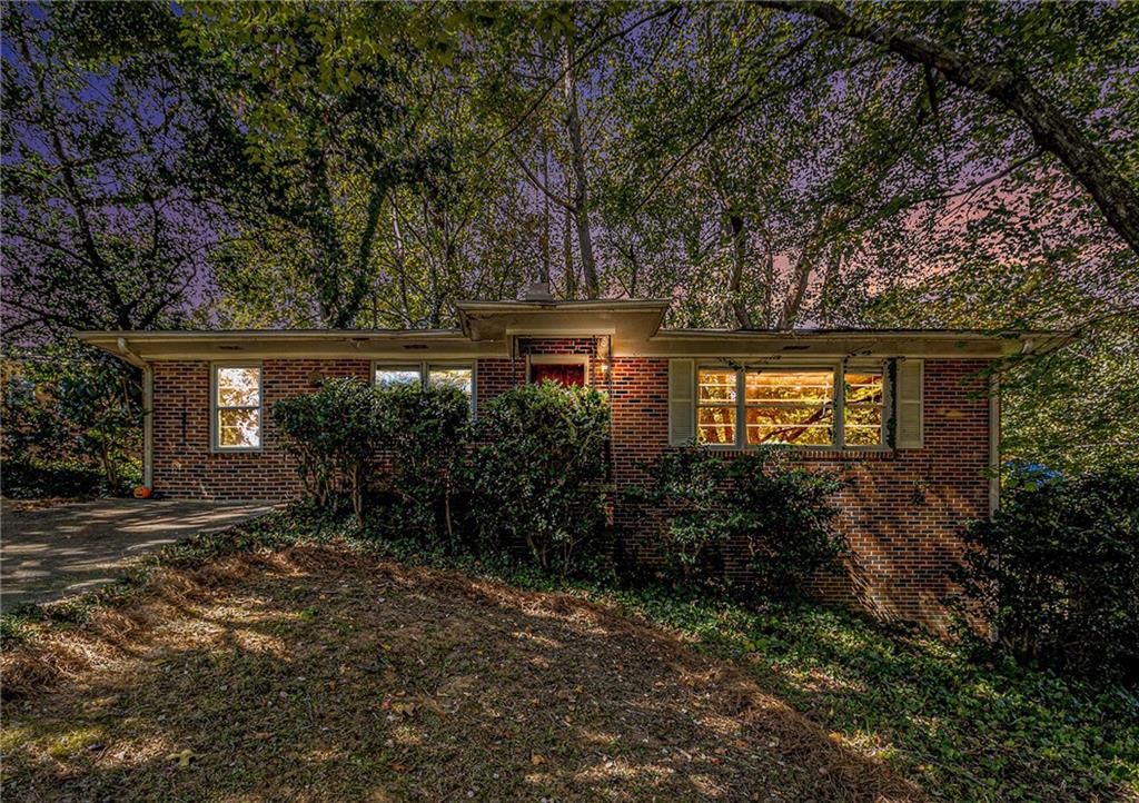 a view of a house with a tree