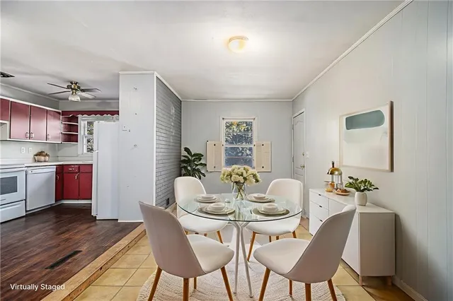a dining room with furniture and wooden floor