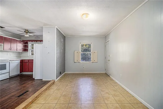 a view of a kitchen with wooden floor and a kitchen
