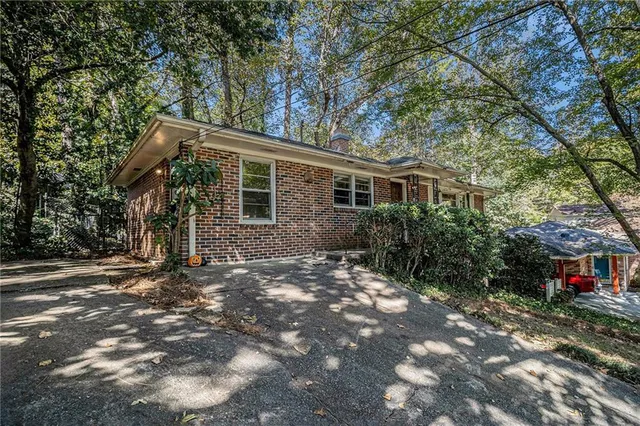 a view of a house with a tree