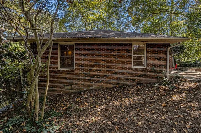front view of a house with a brick wall
