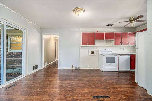 a view of kitchen with stainless steel appliances granite countertop a stove and a refrigerator
