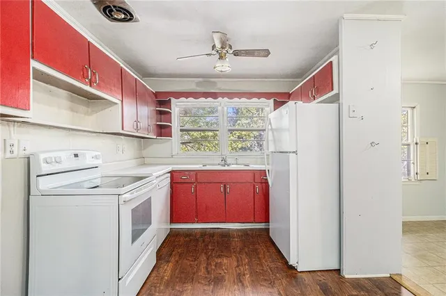 a kitchen with stainless steel appliances granite countertop a refrigerator sink and cabinets