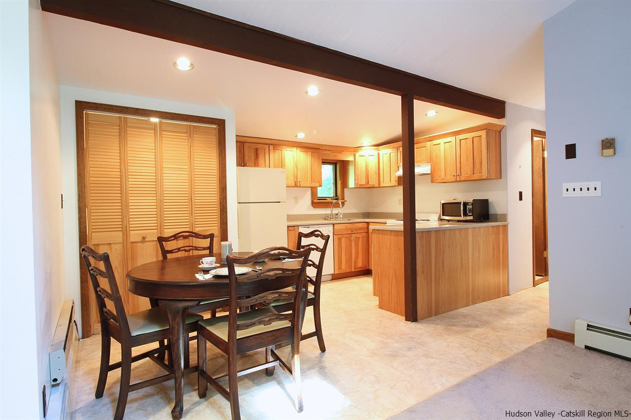 41 Denver Run Spur Roxbury, NY 12421 - Photo 13 of 27 a dining room with furniture and a floor to ceiling window