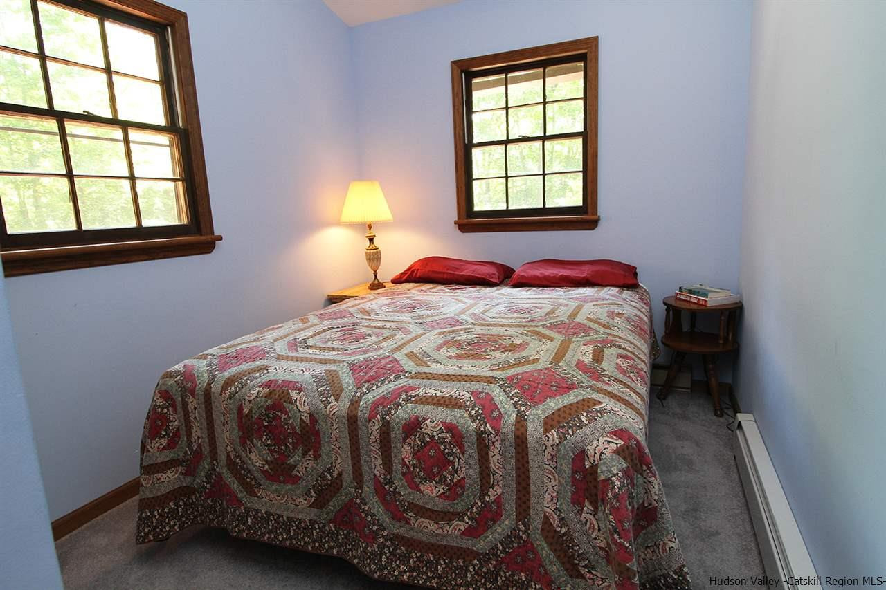 41 Denver Run Spur Roxbury, NY 12421 - Photo 17 of 27 a bedroom with a bed and a window