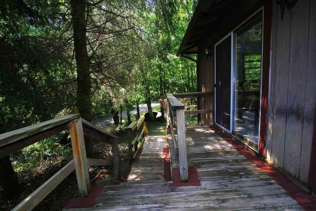 41 Denver Run Spur Roxbury, NY 12421 - Photo 4 of 27 a view of a deck with wooden floor and wooden fence