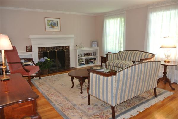 127 Grosvenor Road Needham, MA 02492 - Photo 8 of 21 a living room with furniture and a fireplace