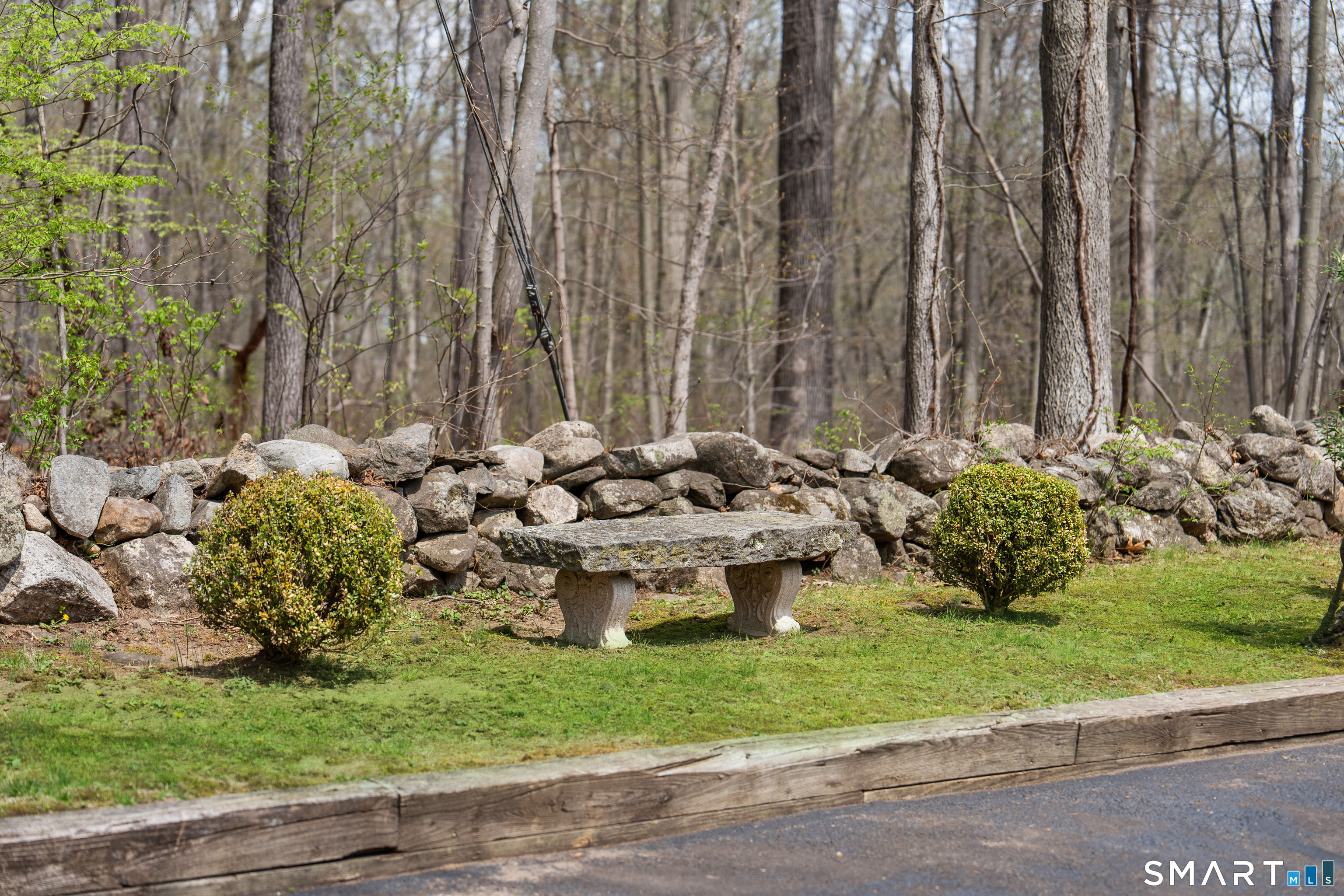 224 Marvin Ridge Road New Canaan, CT 06840 - Photo 32 of 36 a view of a fire pit with large trees