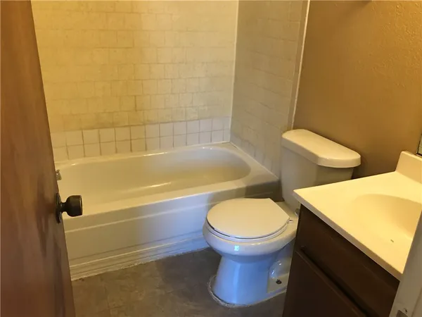 a bathroom with a sink and toilet