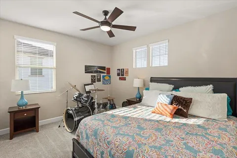 a bedroom with a bed and a couch