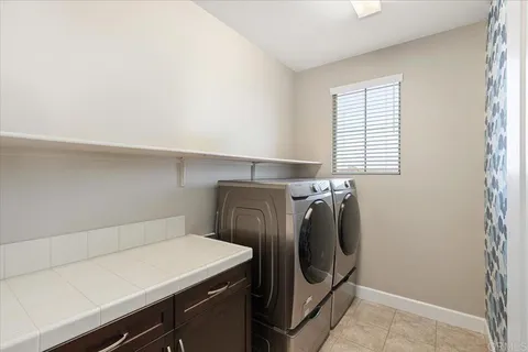 a view of a couches in the patio with a yard