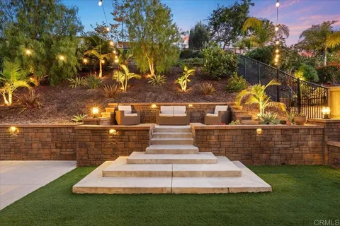 a front view of a building with garden