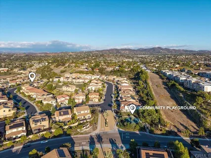 an aerial view of residential building with parking space
