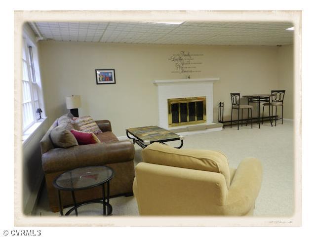 8628 Trabue Road Richmond, VA 23235 - Photo 17 of 24 Den/Family/Great Room - The basement family room is wonderful space for a quiet time at home or big enough for great entertaining.