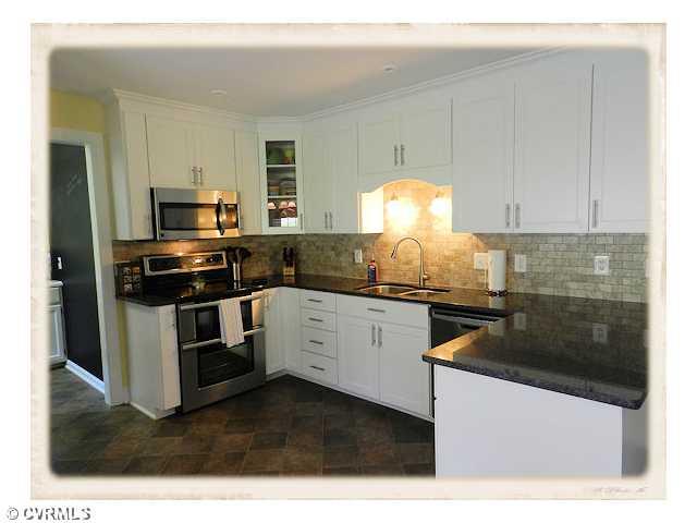 8628 Trabue Road Richmond, VA 23235 - Photo 3 of 24 Kitchen - Beautifully renovated kitchen has new everything, cabinets, granite counters, stainless appliances, tile backsplash.
