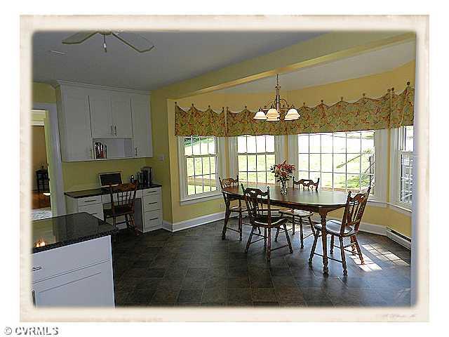 8628 Trabue Road Richmond, VA 23235 - Photo 7 of 24 Breakfast Nook - A fabulous kitchen with this cheerful breakfast area and nearby convenient work desk.