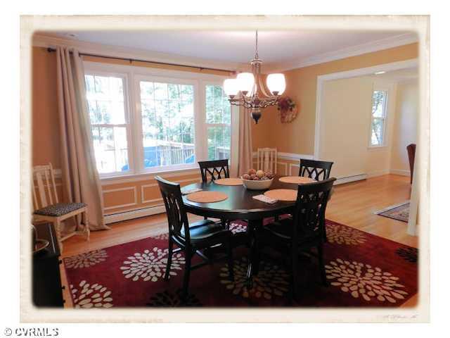 8628 Trabue Road Richmond, VA 23235 - Photo 8 of 24 Dining Room - Beautiful hardwood floors, crown mouldings, chair rail and picture frame wainscoting.