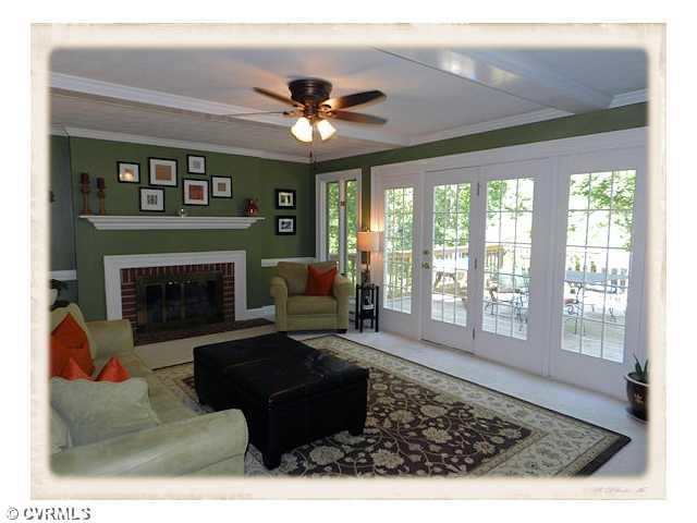 8628 Trabue Road Richmond, VA 23235 - Photo 10 of 24 Den/Family/Great Room - First Floor family room is bright and cheerful with lots of windows, a fireplace and easy access to the deck
