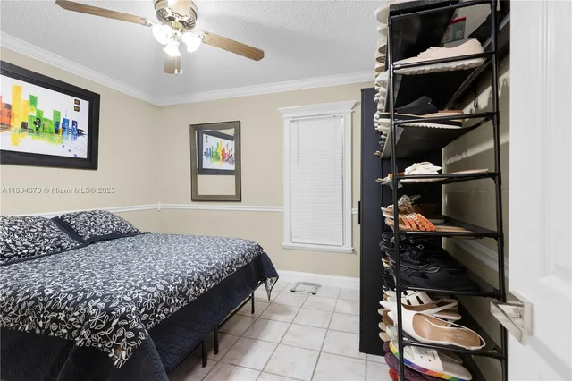 a bedroom with a bed and cabinets