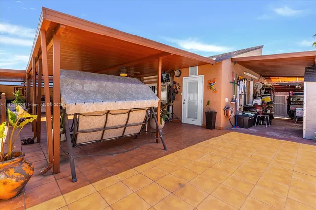 a kitchen with stainless steel appliances a stove a refrigerator and cabinets