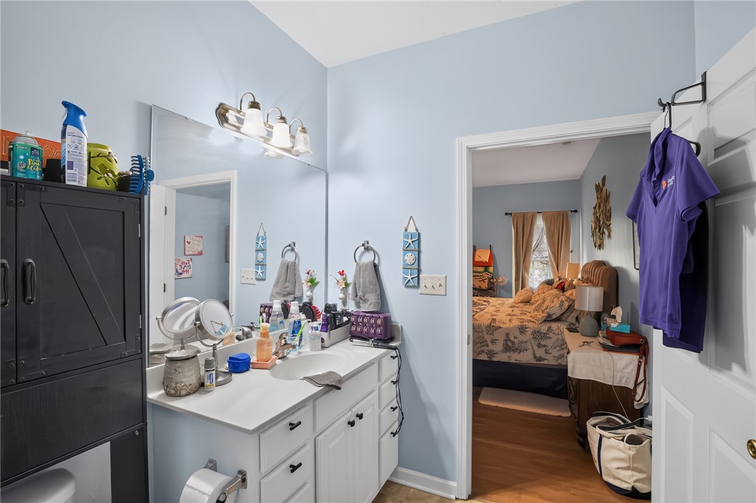 144 Elliott Circle Anderson, SC 29621 - Photo 26 of 30 A full bathroom offers a vanity with ample counter space, conveniently connecting to a serene bedroom.