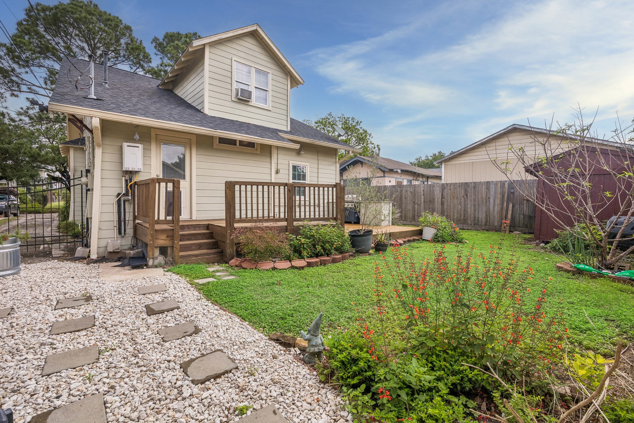 4412 Rusk Street Houston, TX 77023 - Photo 32 of 44 Another view of expanded patio with stairs leading to large deck & grill!