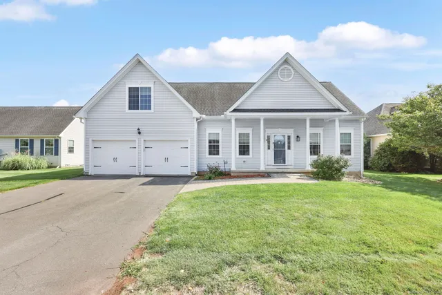 front view of a house and a yard