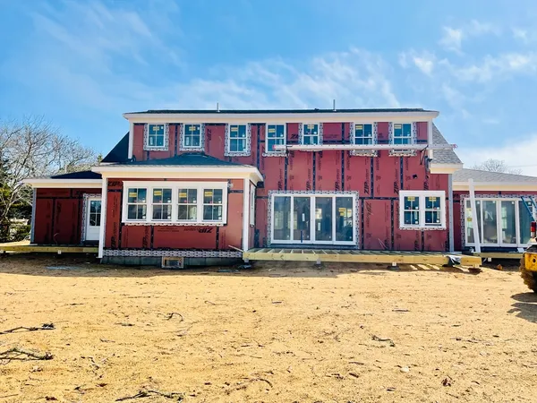a view of a brick house with many windows