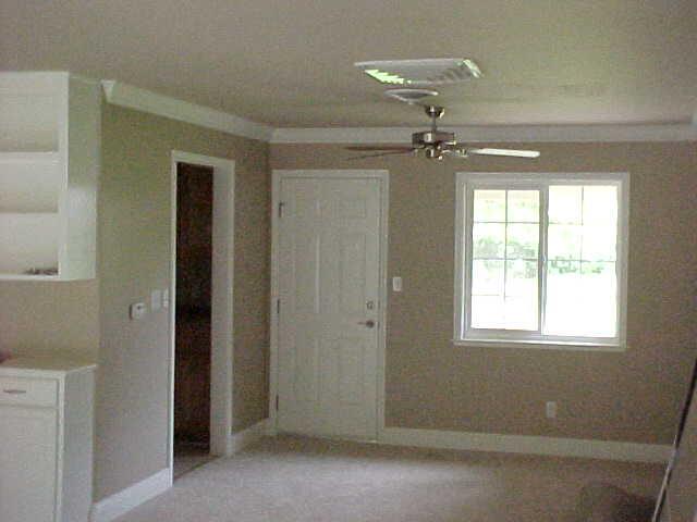 7645 Happy V Road Anderson, CA 96007 - Photo 3 of 3 a view of a livingroom with a ceiling fan and window