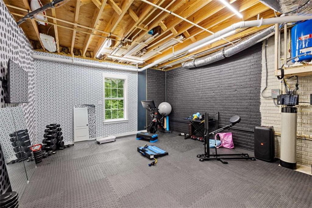 128 Byrom Road Senoia, GA 30276 - Photo 55 of 83 a view of a room with gym equipment