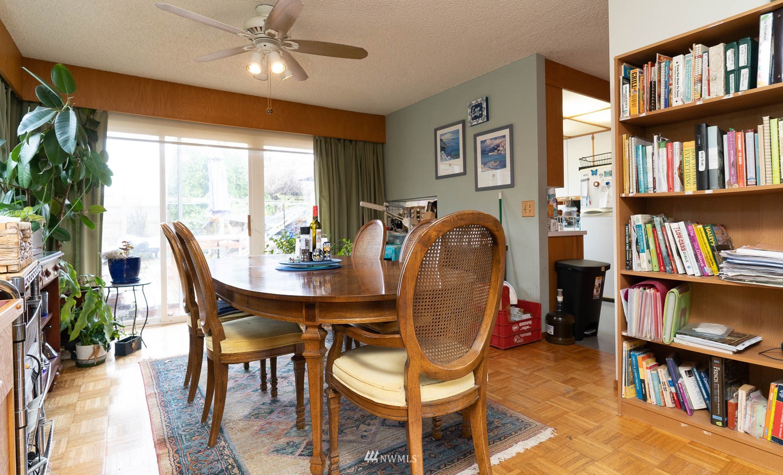 5854 Laurel Ridge Way Bellingham, WA 98226 - Photo 14 of 20 a dining room with furniture a book shelves and wooden floor
