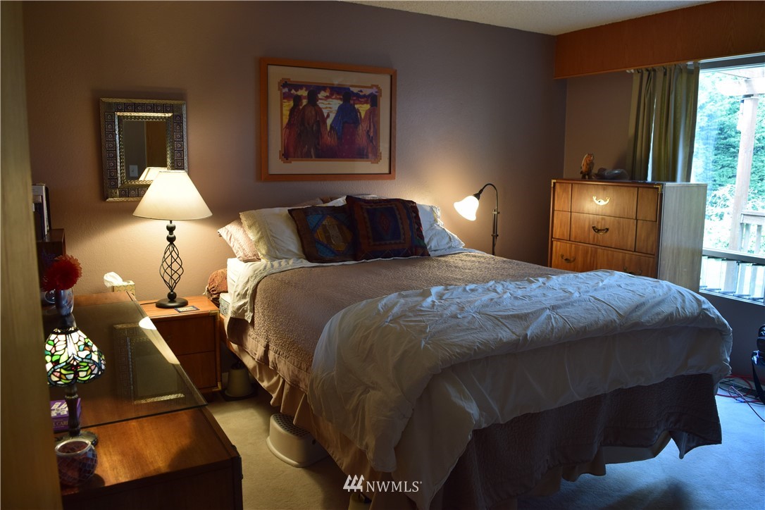 5854 Laurel Ridge Way Bellingham, WA 98226 - Photo 18 of 20 a bedroom with a bed and a lamp