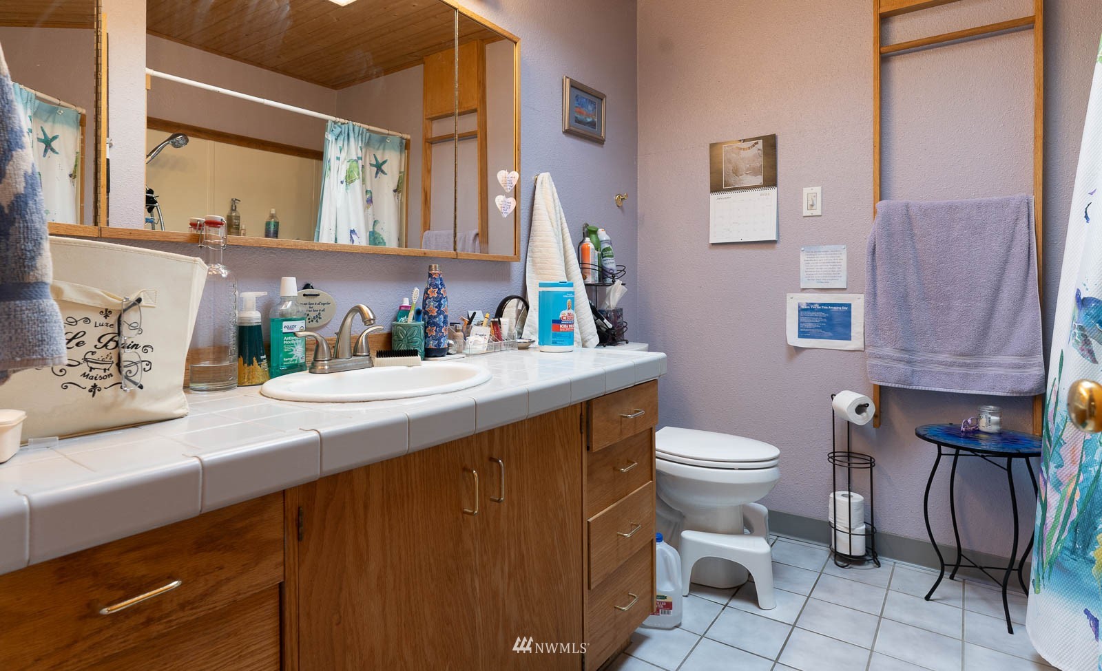 5854 Laurel Ridge Way Bellingham, WA 98226 - Photo 20 of 20 a bathroom with a granite countertop toilet sink and mirror