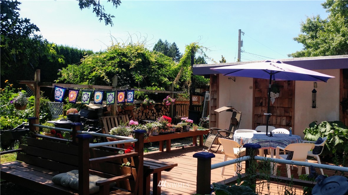 5854 Laurel Ridge Way Bellingham, WA 98226 - Photo 2 of 20 a view of a dinning tables and chairs in a patio