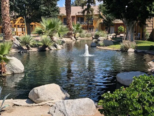 a view of swimming pool with outdoor seating
