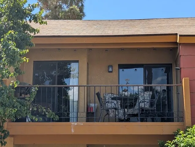 a view of balcony with furniture