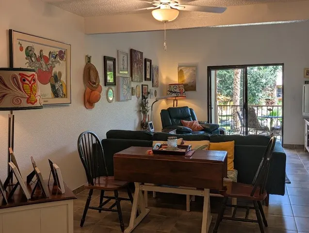 a dining room with furniture and window
