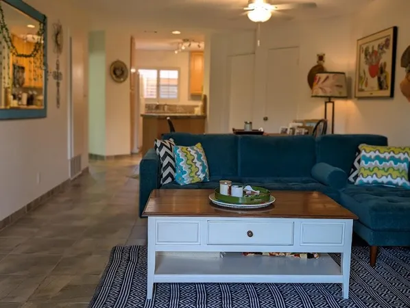 a living room with furniture and a table