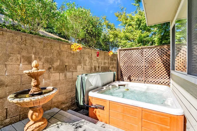 a view of a backyard with chair and table
