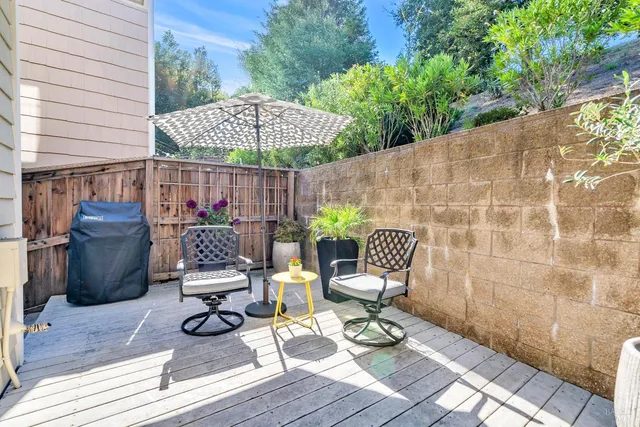 a patio with a patio table and chairs