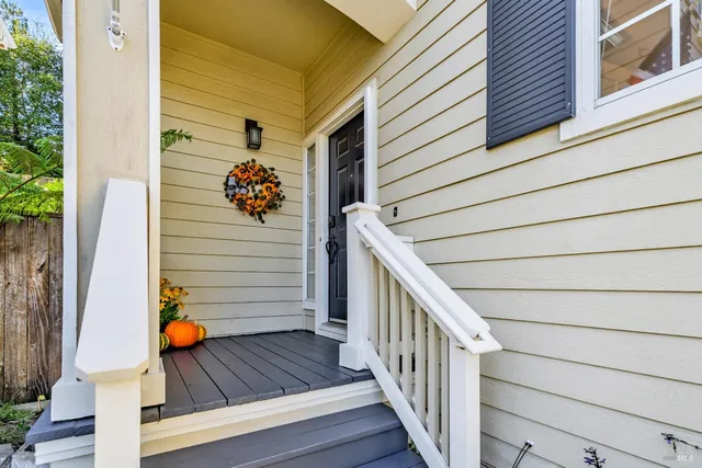 a view of a balcony with wooden floor and stairs