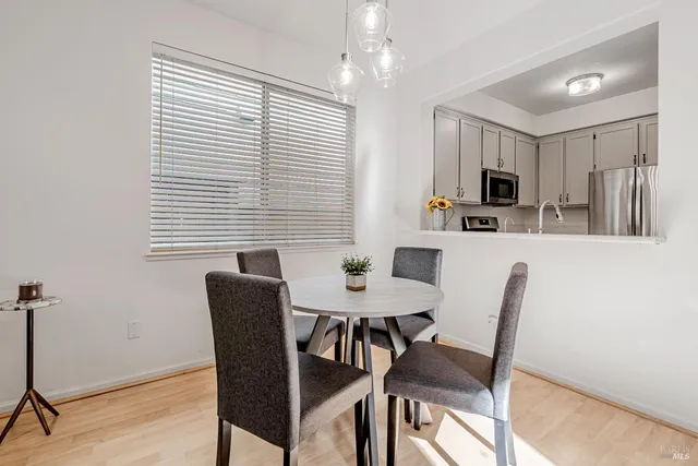 a view of a dining room with furniture and window