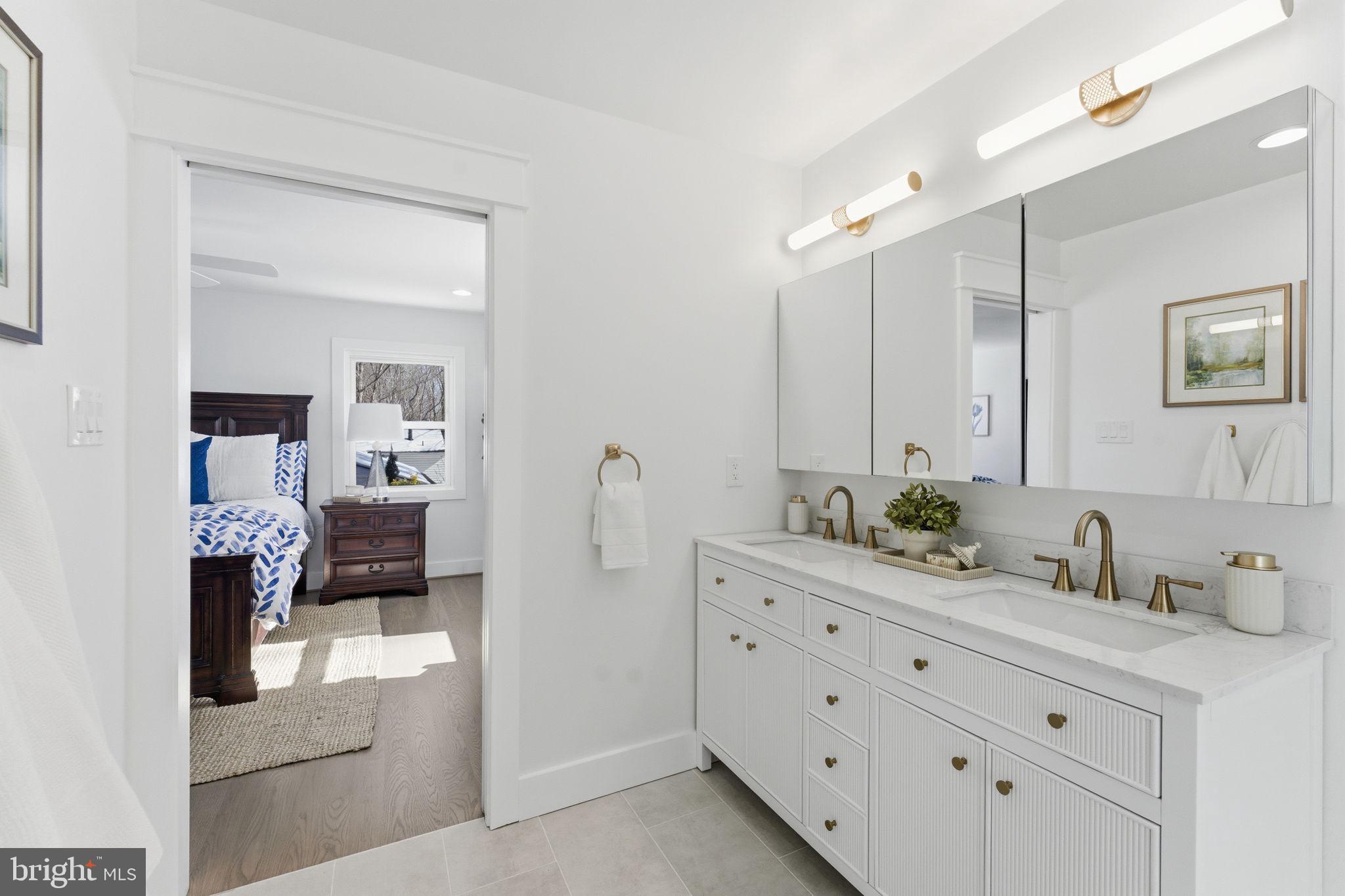 8615 Kerry Lane Springfield, VA 22152 - Photo 18 of 50 a bathroom with a sink and a mirror