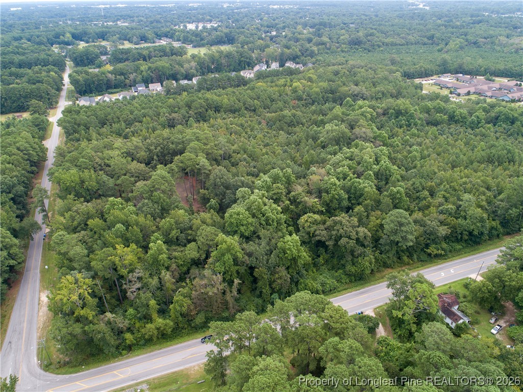 0 Seventy First School Road Fayetteville, NC 28314 - Photo 13 of 17 an aerial view of residential houses with outdoor space and trees
