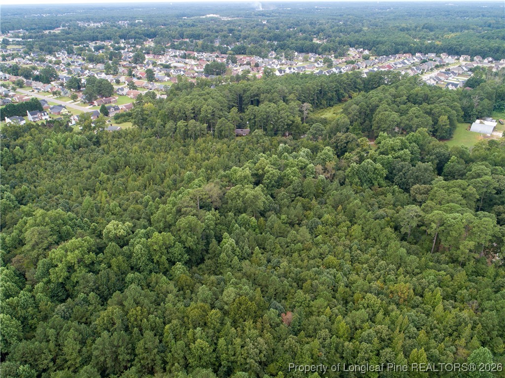 0 Seventy First School Road Fayetteville, NC 28314 - Photo 16 of 17 an aerial view of residential houses with outdoor space and trees