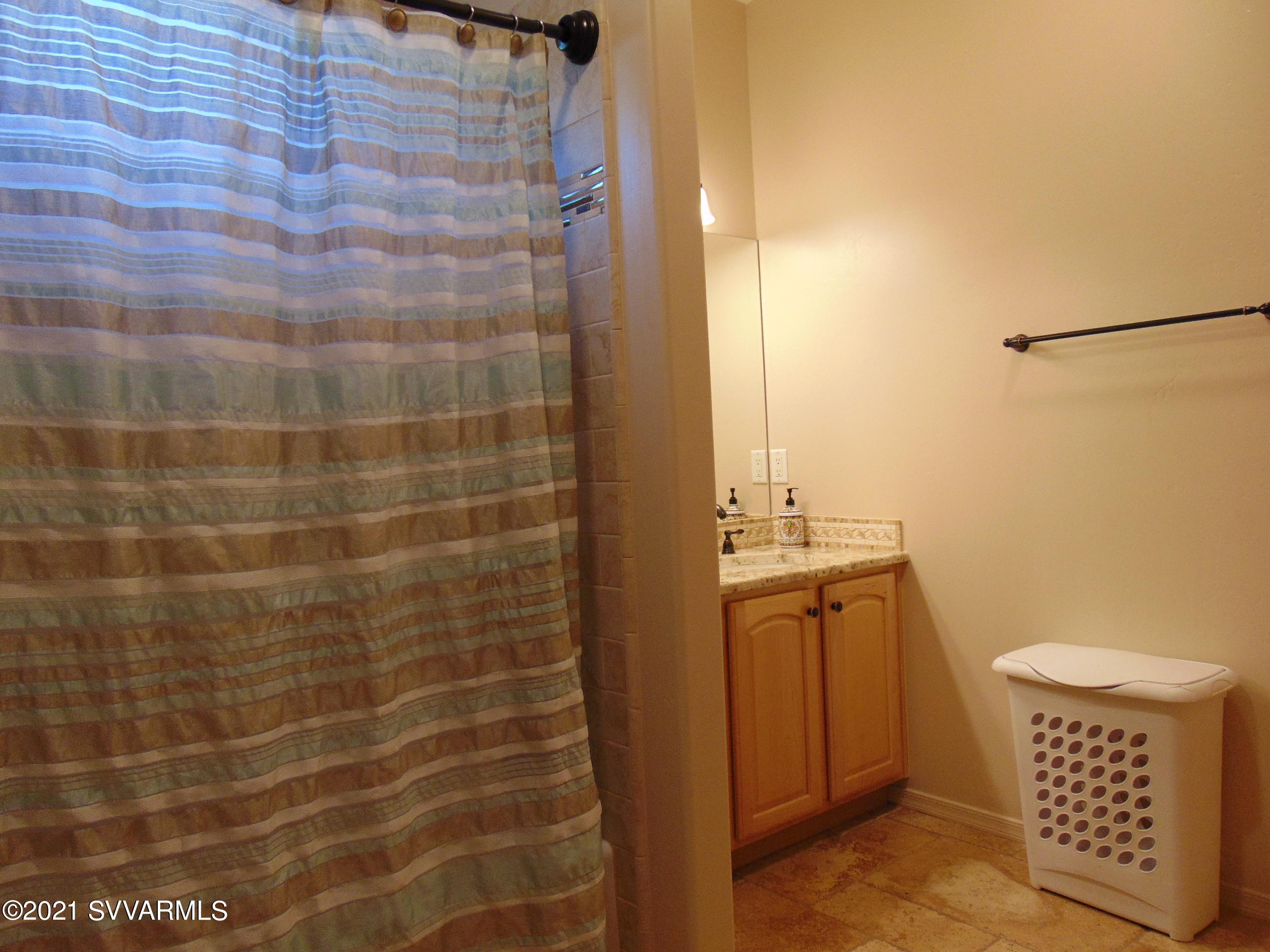 3995 East Beaver Vista Road Rimrock, AZ 86335 - Photo 22 of 40 a bathroom with a sink and a mirror