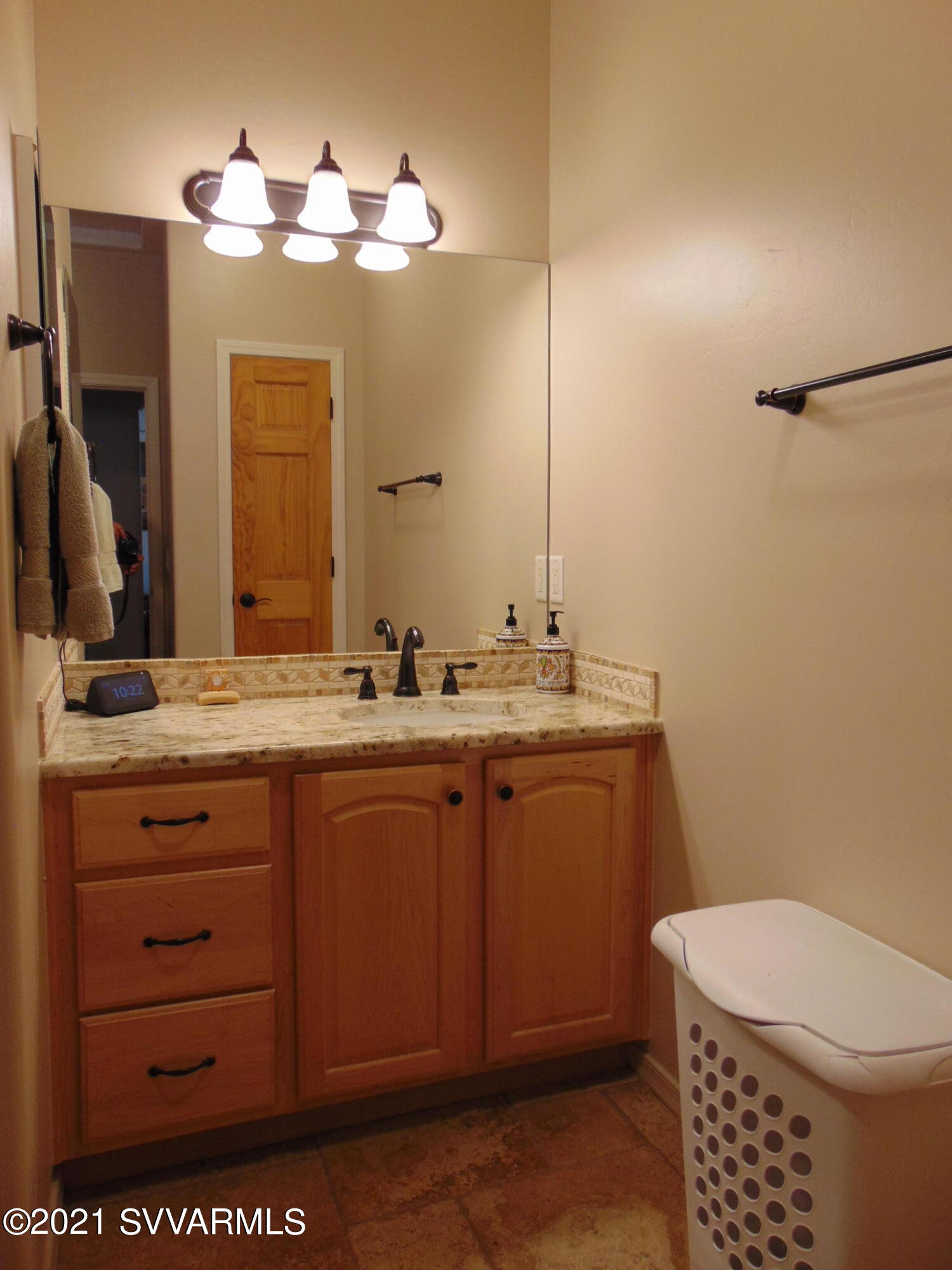 3995 East Beaver Vista Road Rimrock, AZ 86335 - Photo 23 of 40 a bathroom with a sink a toilet and a mirror