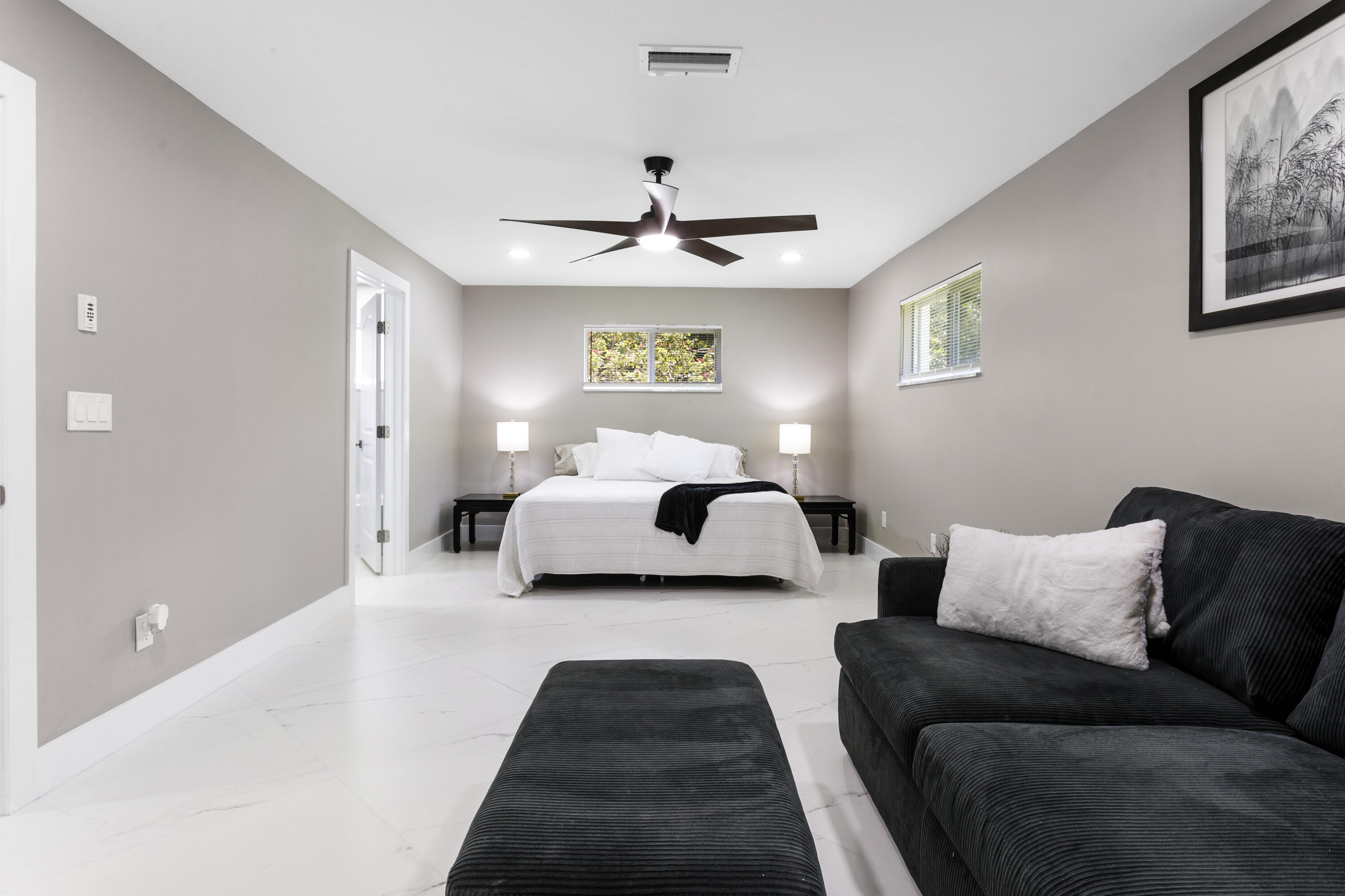 5200 Club Road Haverhill, FL 33415 - Photo 16 of 33 a bedroom with bed and a couch