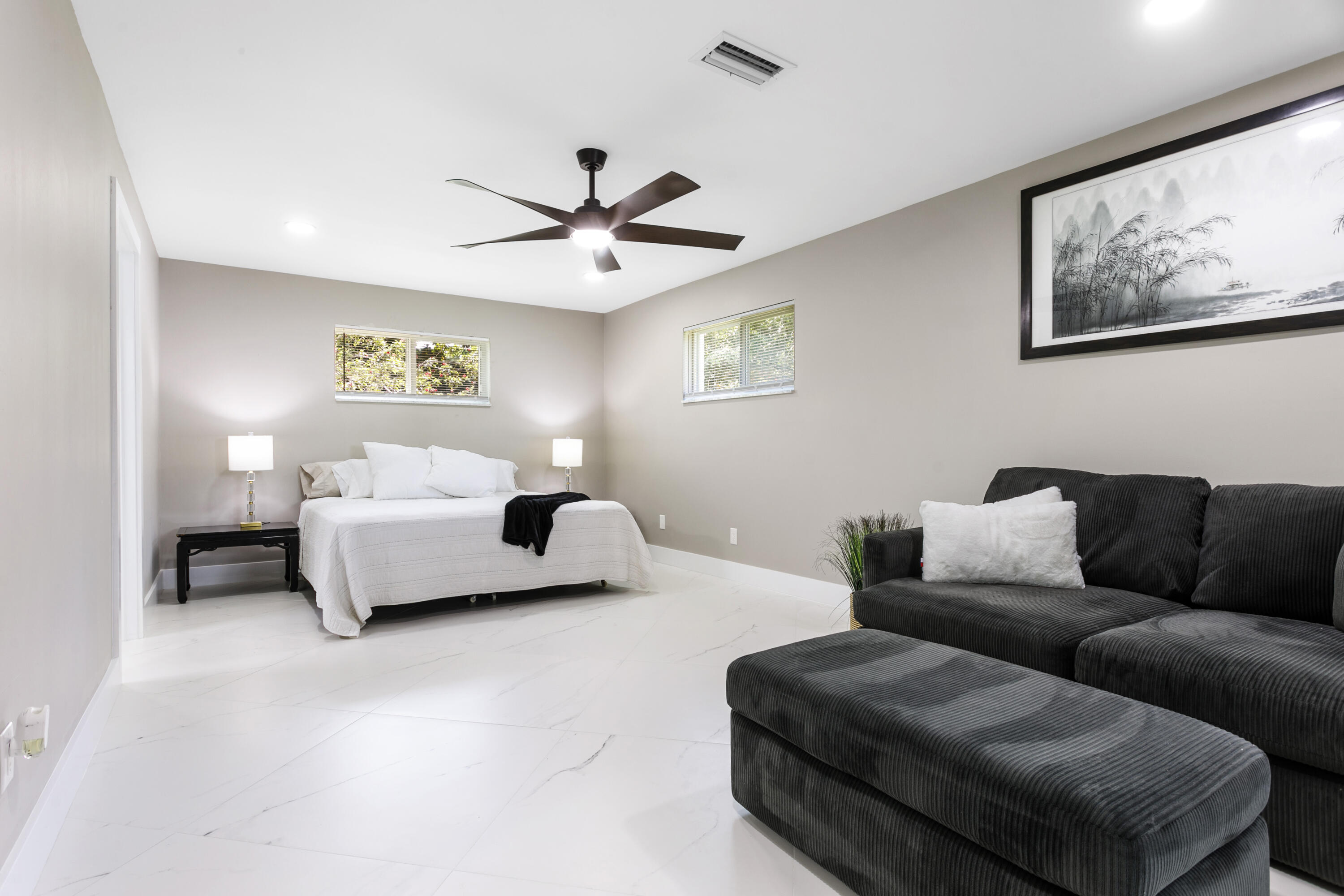 5200 Club Road Haverhill, FL 33415 - Photo 17 of 33 a bedroom with furniture and a ceiling fan