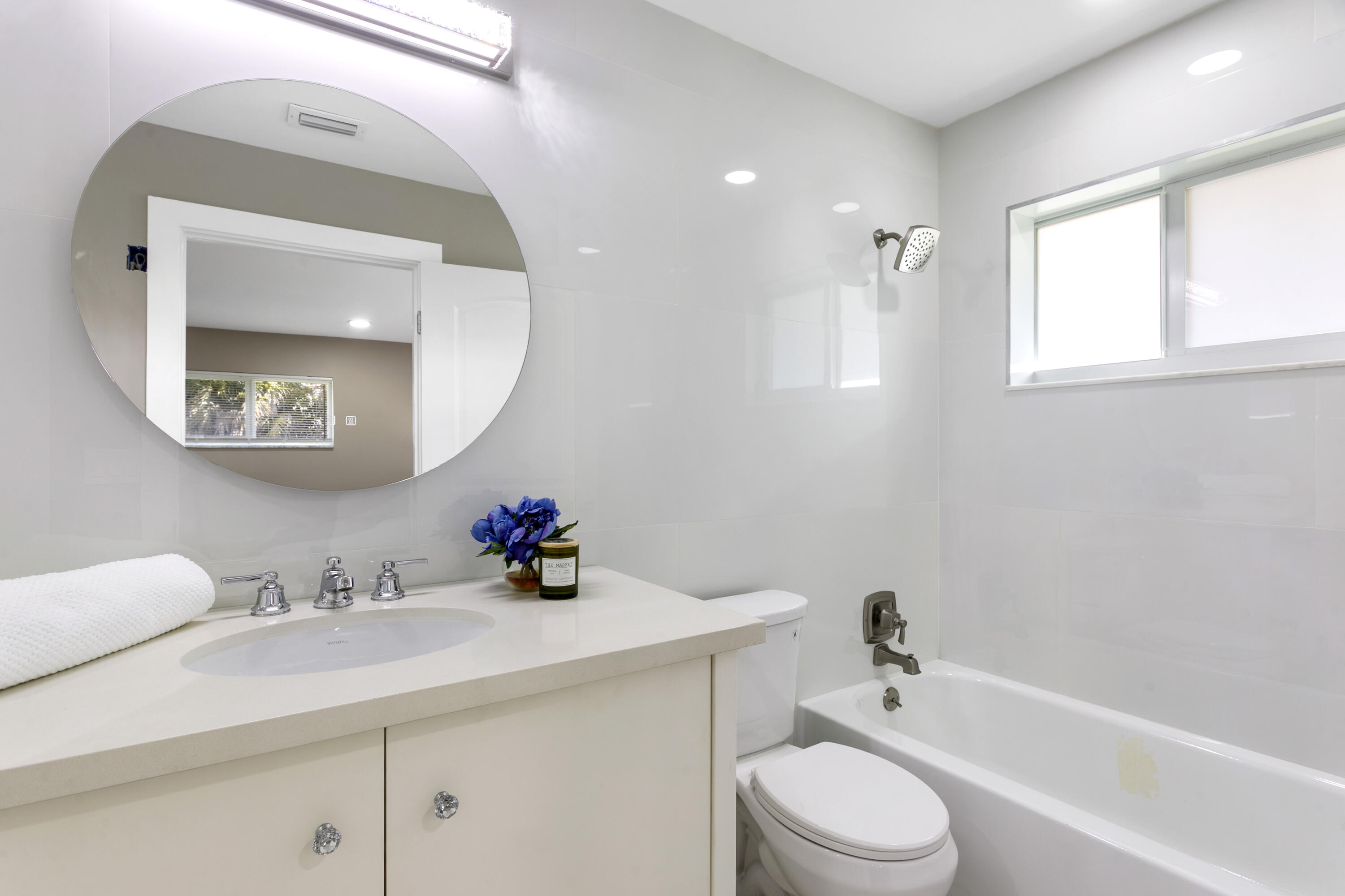 5200 Club Road Haverhill, FL 33415 - Photo 18 of 33 a bathroom with a sink a toilet and shower